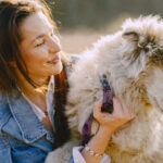 Pet Care Owner With Dog Bonding Outdoors 150x150