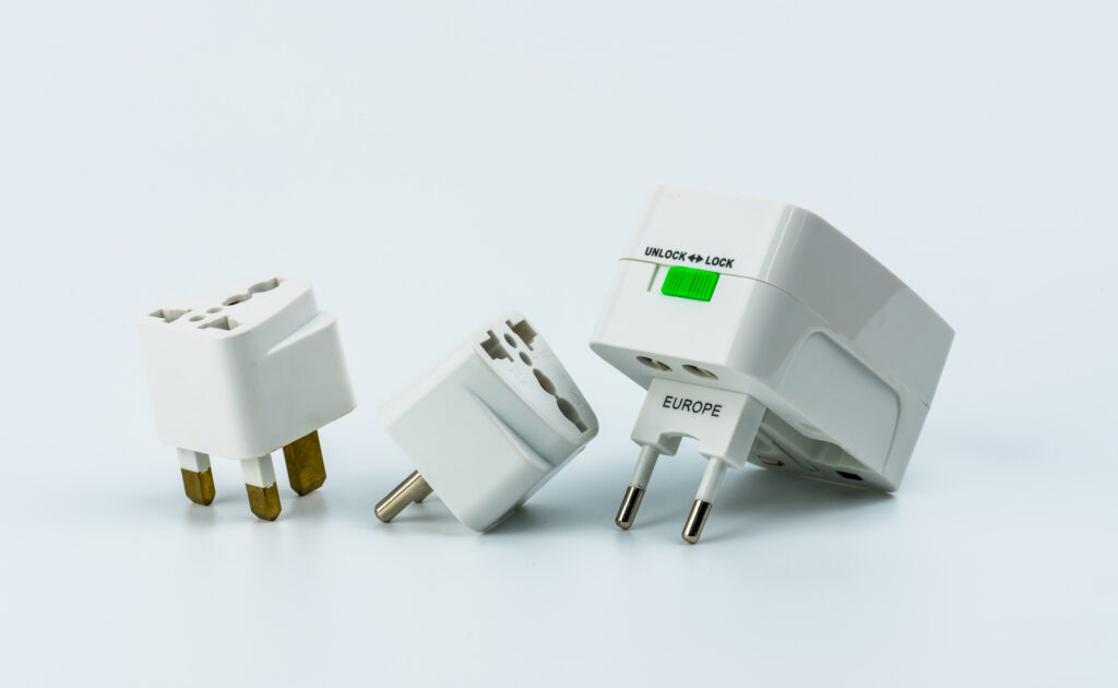 set of universal plug adapters for travel around the world isola